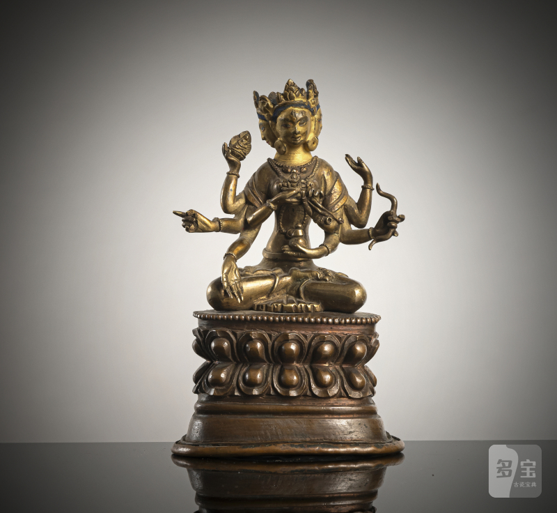 A BRONZE FIGURE OF USHNISHAVIJAYA